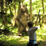 Lad shooting 2D bear